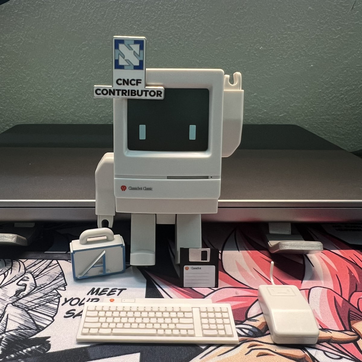 Not from the meetup: the CNCF Contributor badge on the Classicbot on my desk, that evening